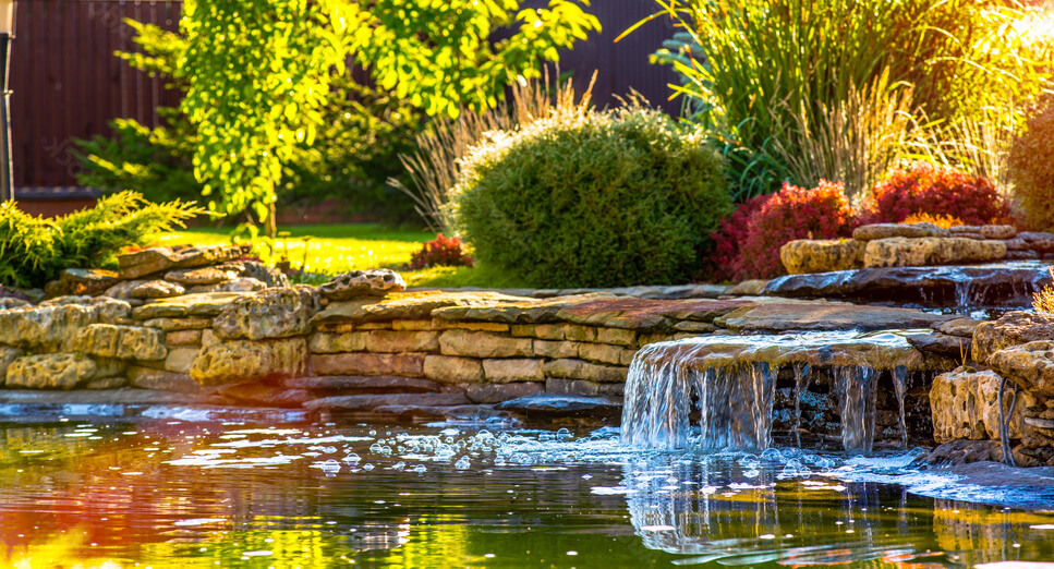 Water pond with rock border and waterfall