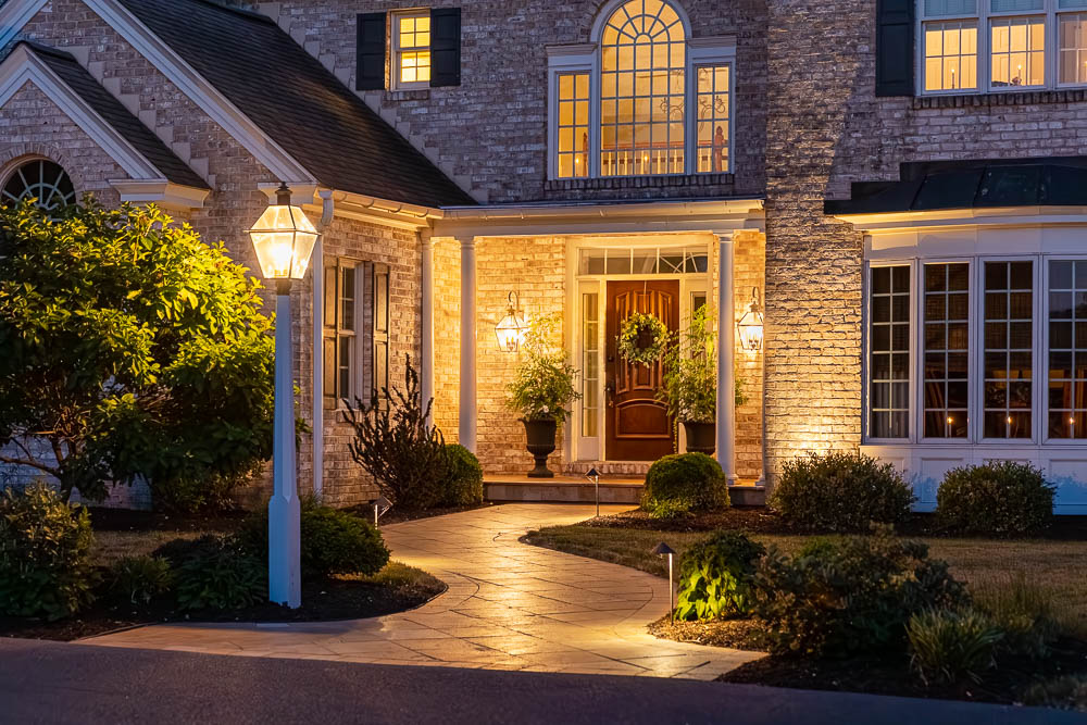 paver walkway to the front door of a houes